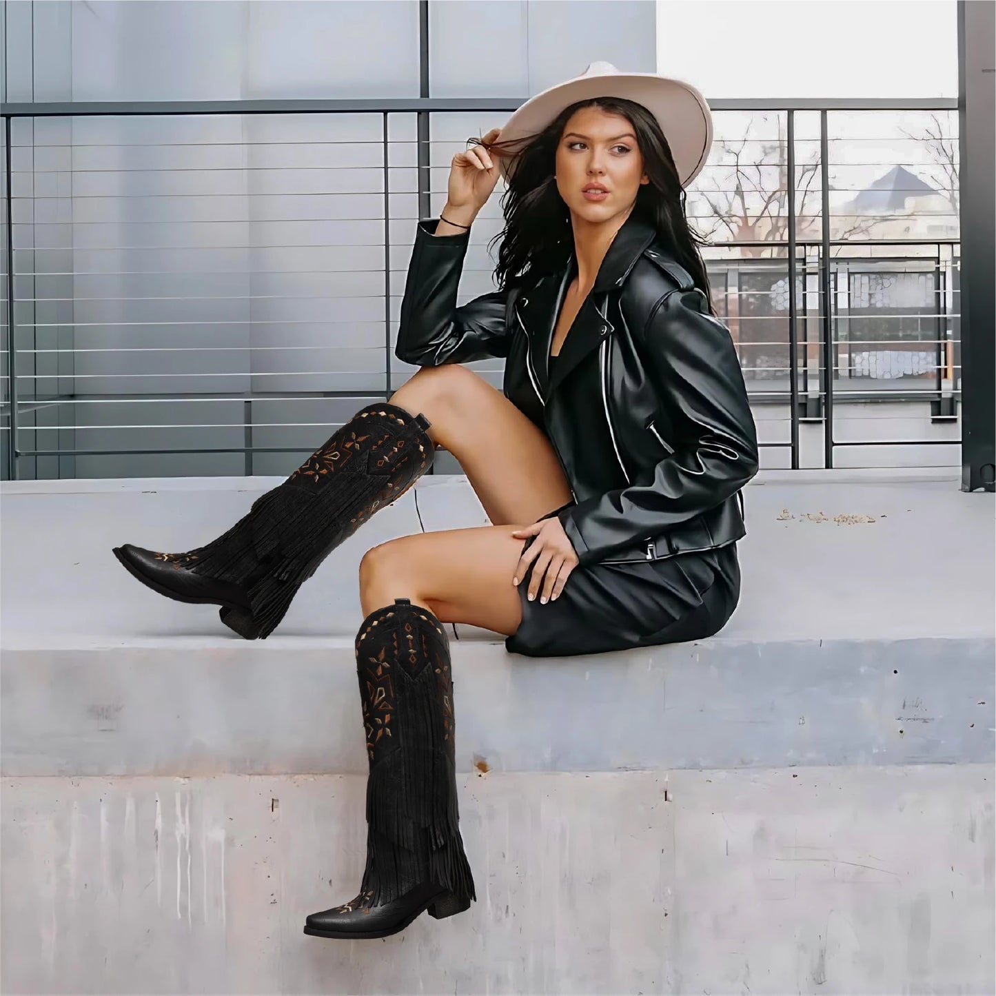 Women's knee-high cowgirl boots with fringe, classic embroidery, and pointed toe. Retro style for western events.