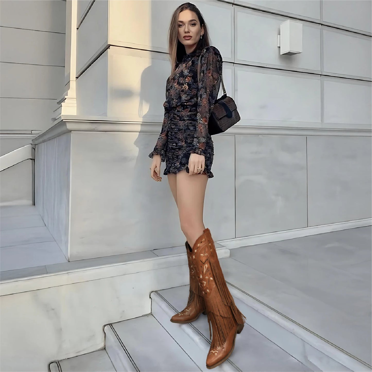 Women's knee-high cowgirl boots with fringe, classic embroidery, and pointed toe. Retro style for western events.